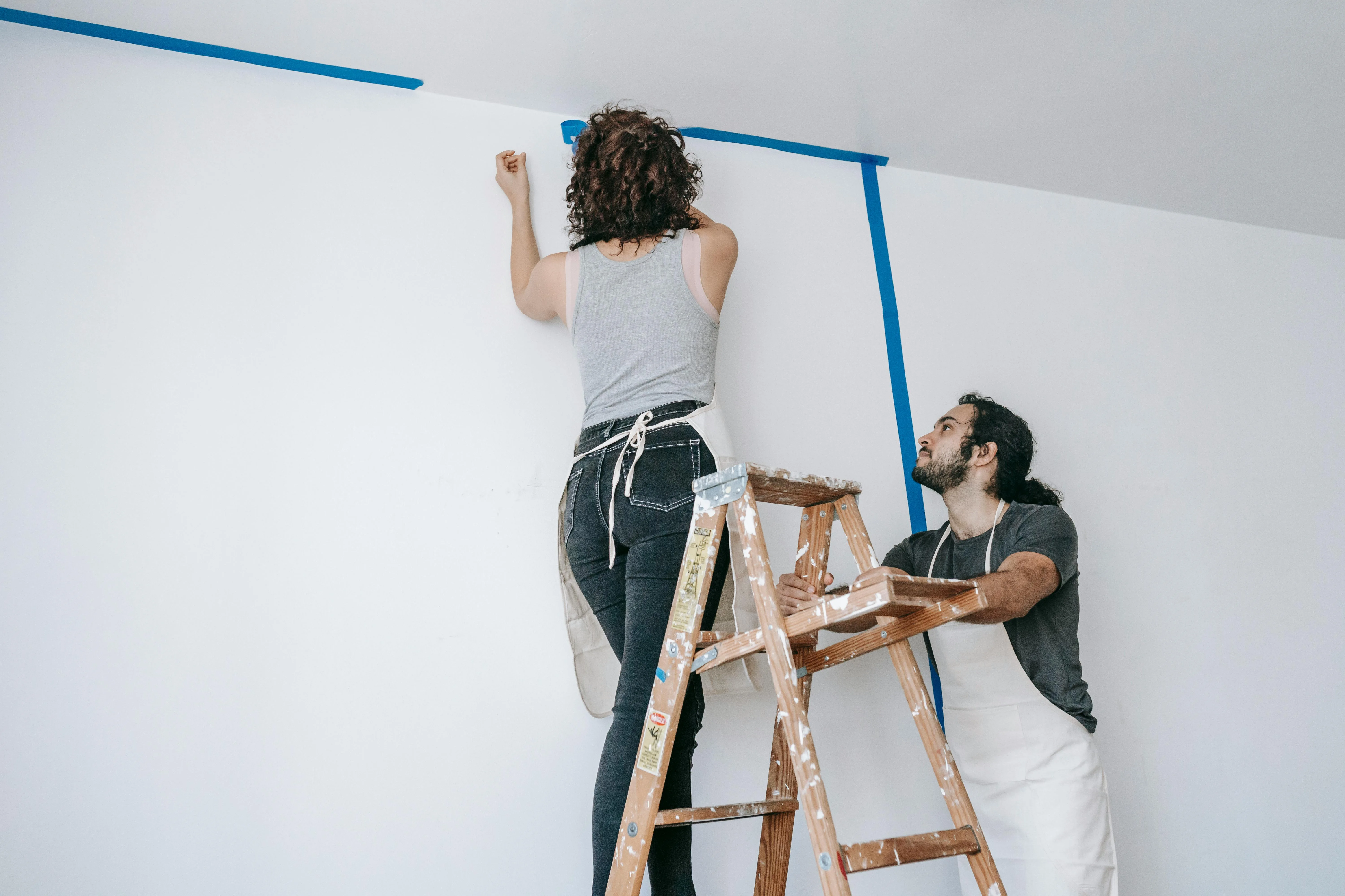 Volunteers painting a room
